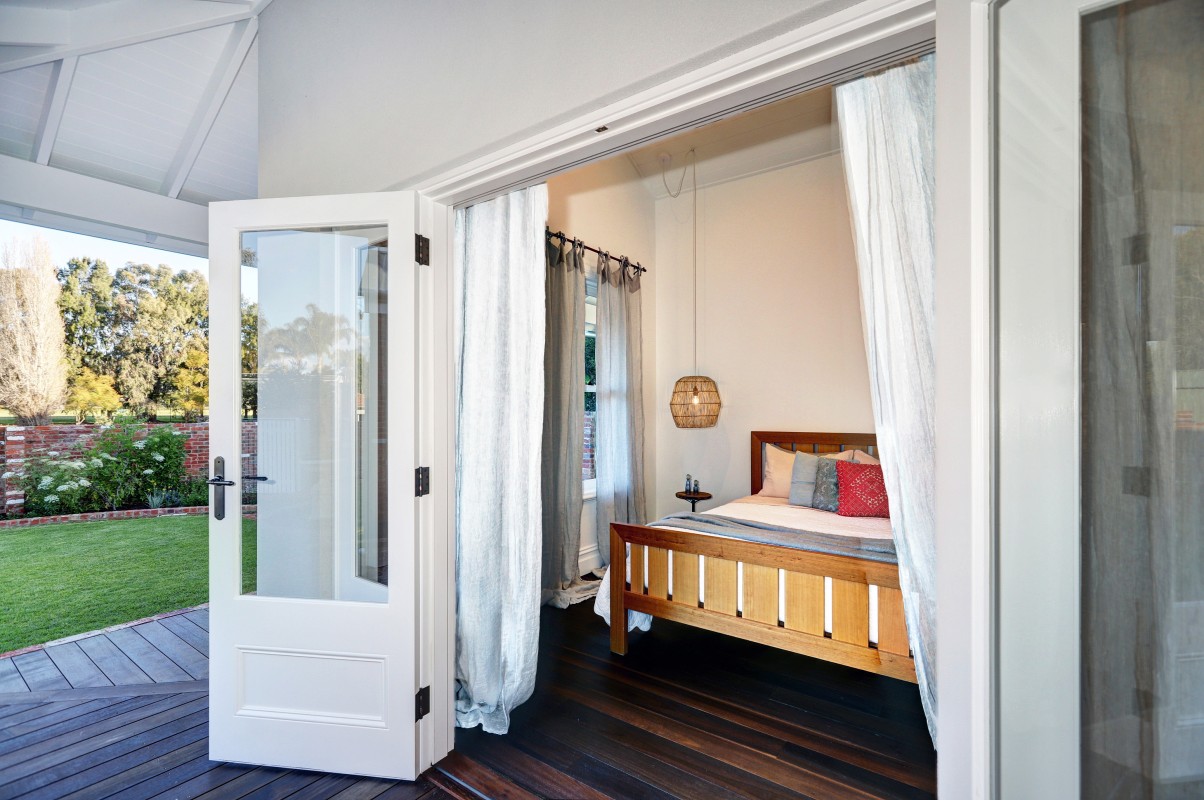 Bifold doors timber painted white Cedar West