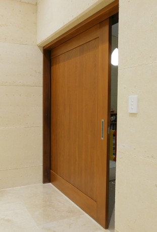 Cavity sliding door timber limestone hidden wall Cedar West