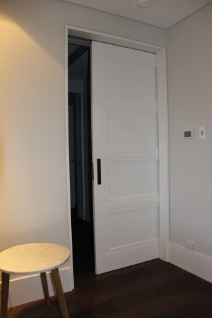 Cavity sliding door timber white painted panelled Cedar West